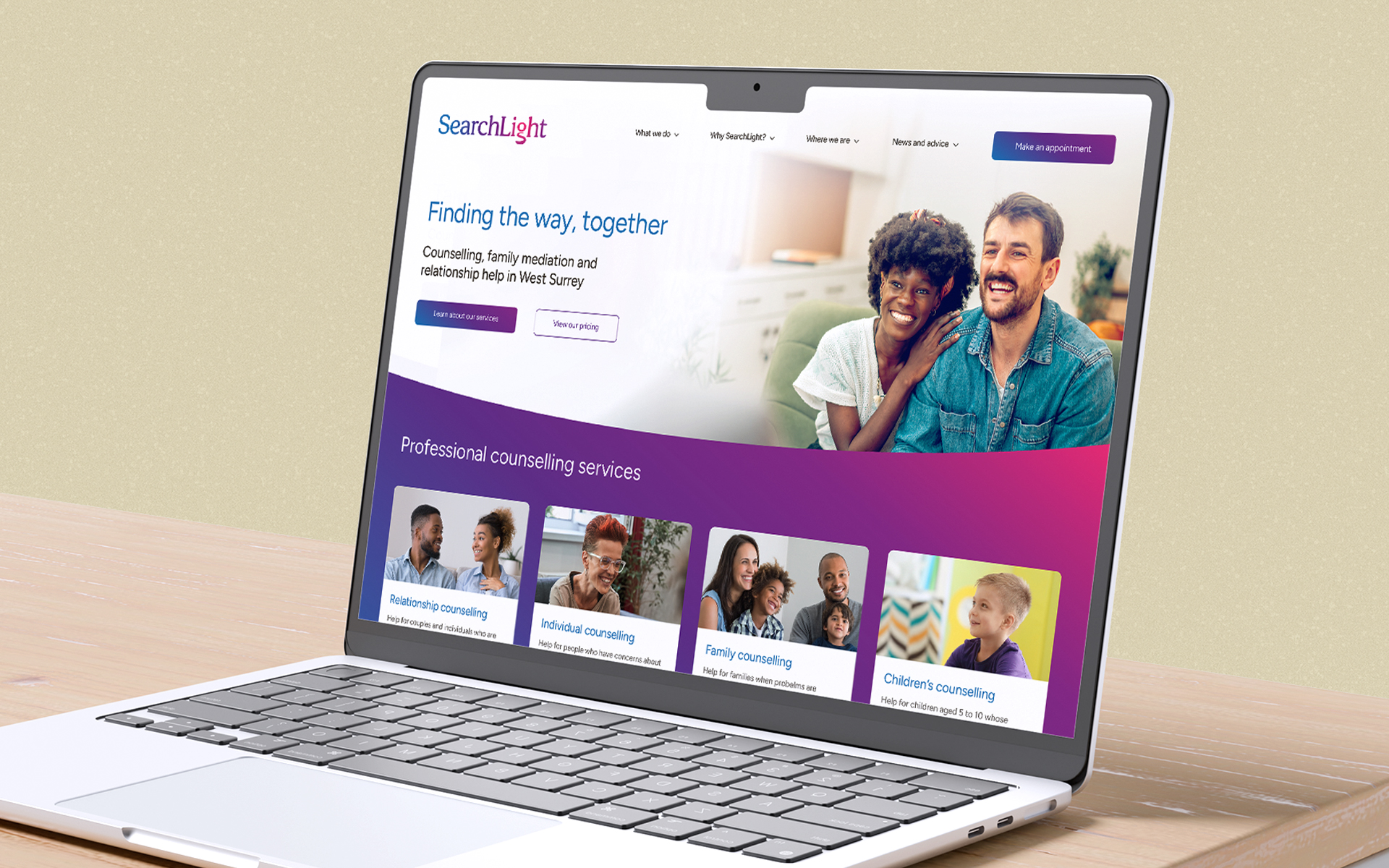 SearchLight website homepage showing on a laptop